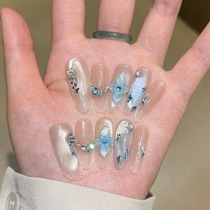Artificial nails with unique floral design and glitter accents Stornfield