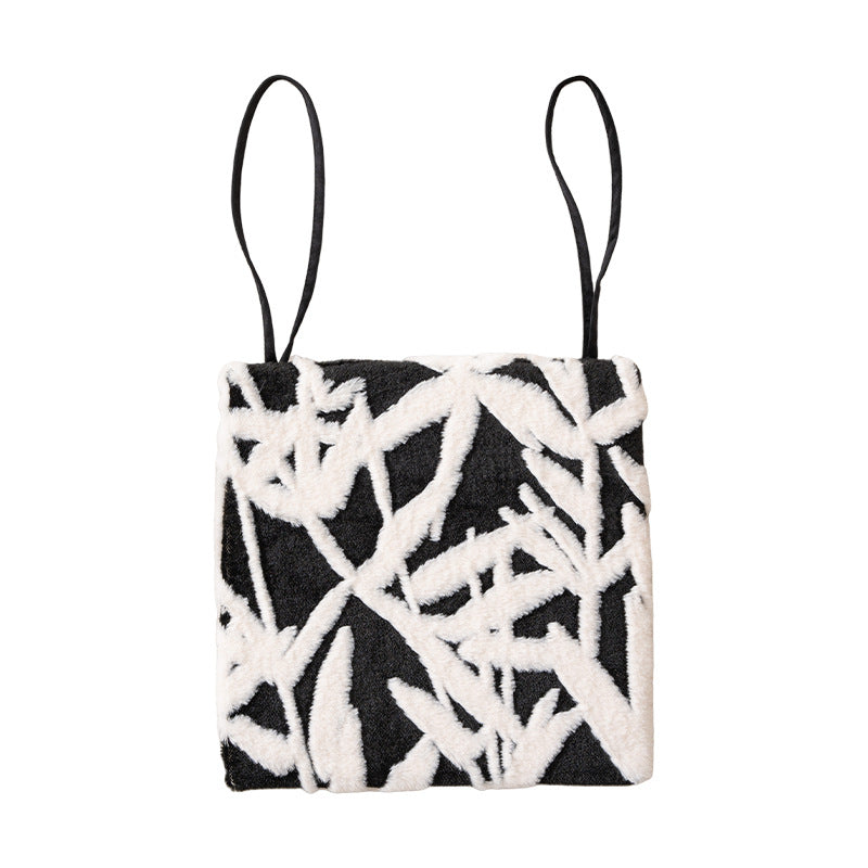Padded seat cushion with hand-tufted leaf pattern and fastening ties Stornfield