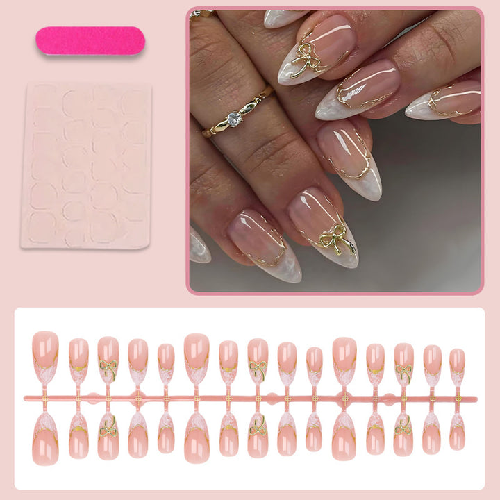 Acrylic nail set with elegant tips and delicate embellishments Stornfield