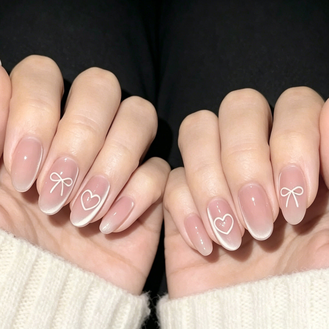 Elegant Heart and Bow Nail Art Stornfield