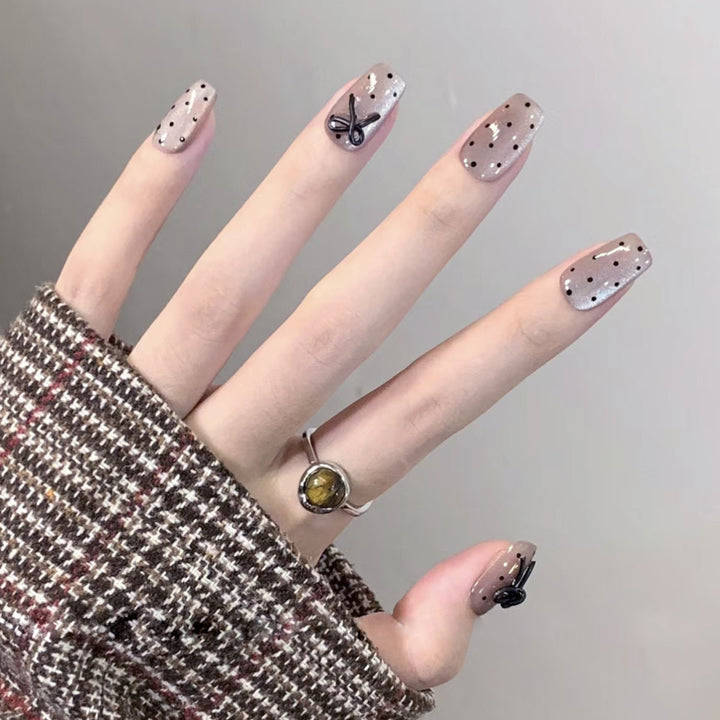 Artful Nail Extensions with Bow Pattern Stornfield