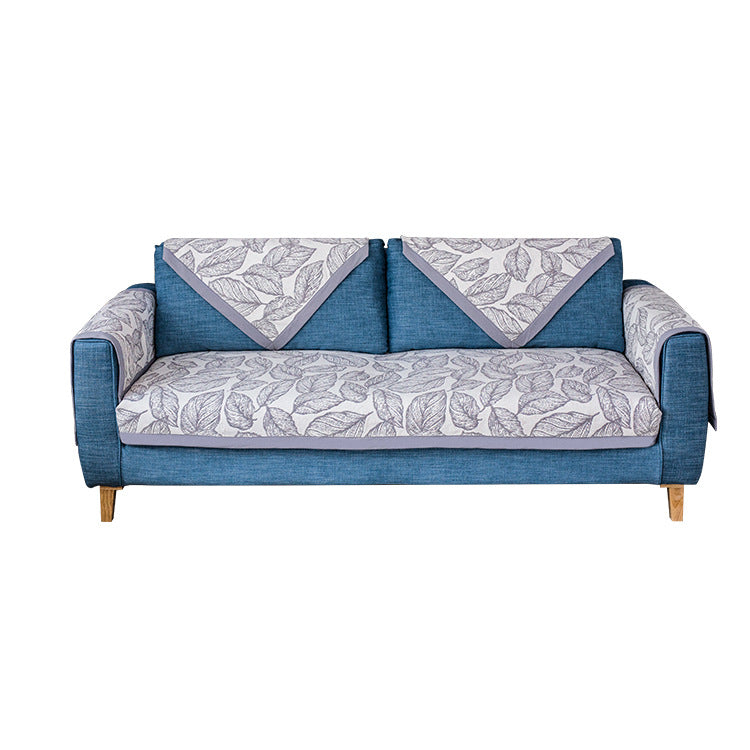 Universal sofa protective cover for three-seater with leaf print, non-slip underside and separate armrest covers Stornfield