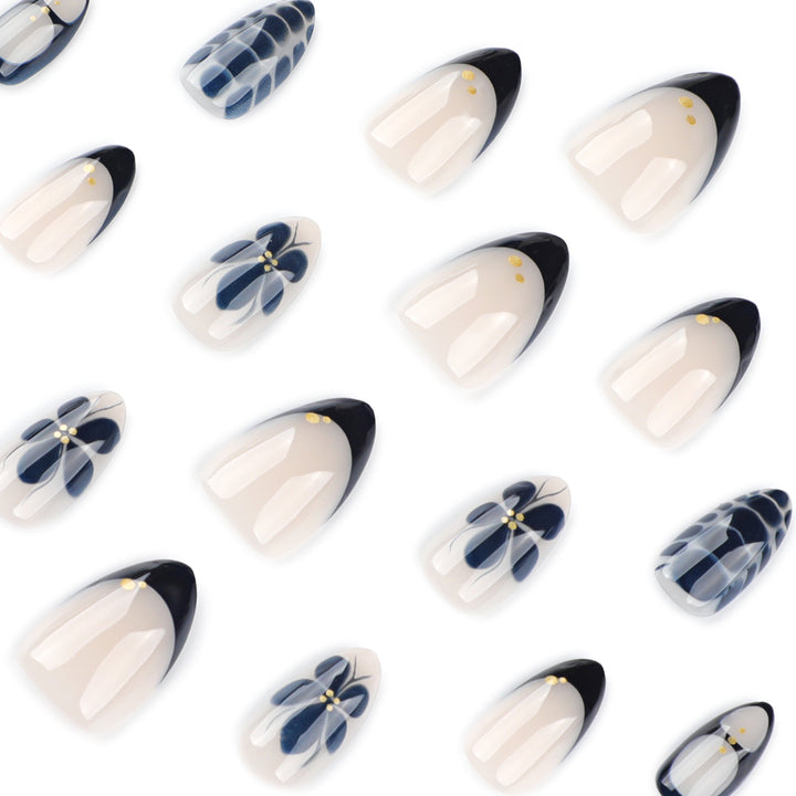 Artful nail art in elegant stiletto design with floral accents Stornfield