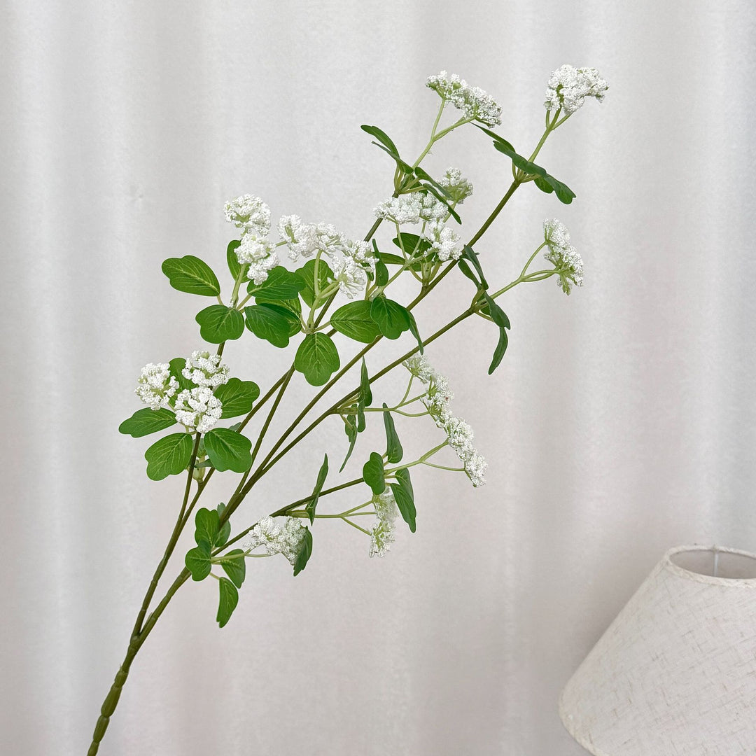 Artificial blossom branch with purple flowers
