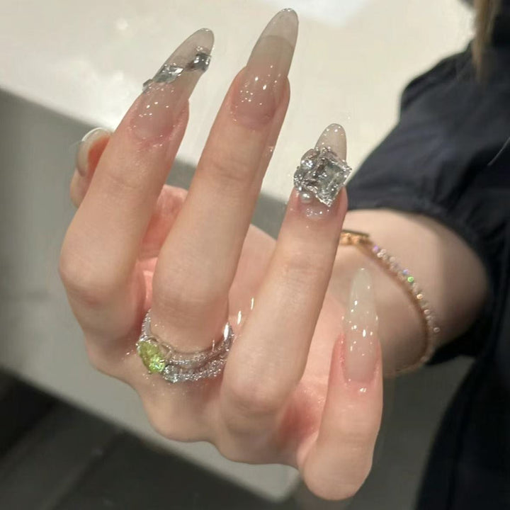 Elegant Stiletto Nail Extensions with Rhinestone Accents Stornfield
