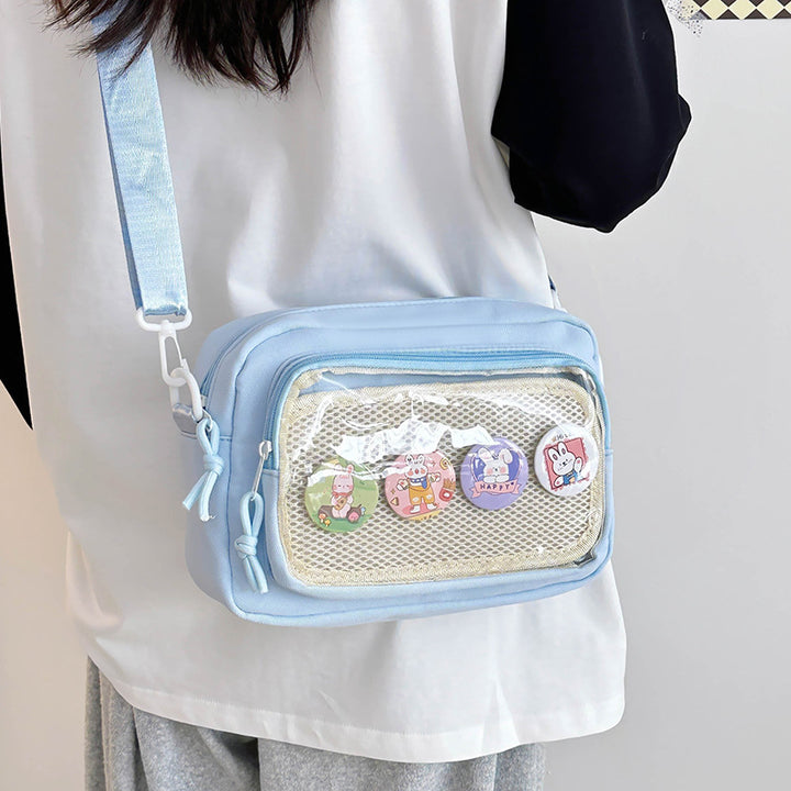 Shoulder bag with transparent viewing pocket and playful graphic design Stornfield