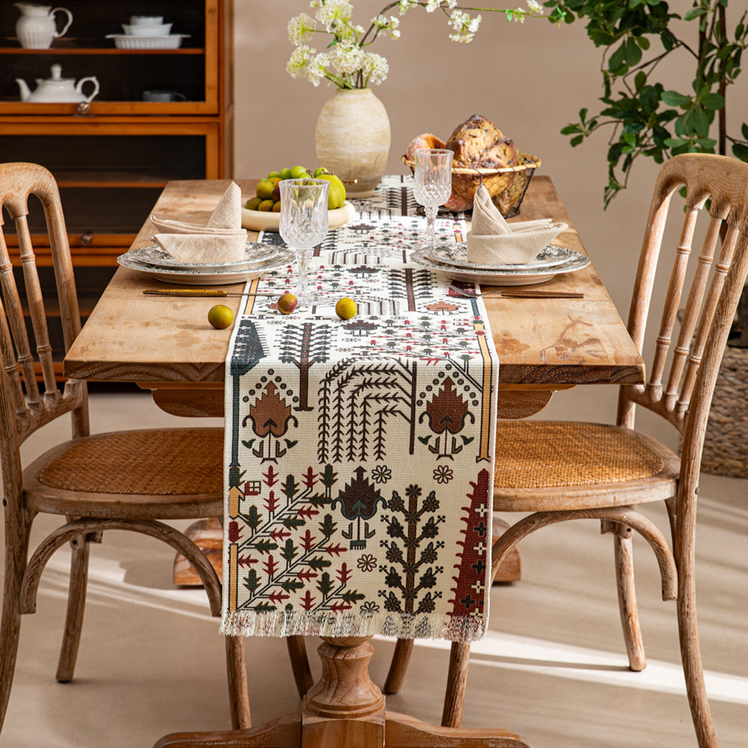 Woven table runner with flower jacquard, fringes and cotton blend