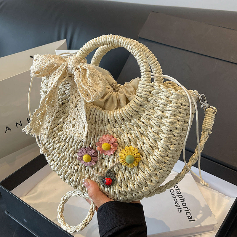 Handcrafted Floral Accent Straw Handbag