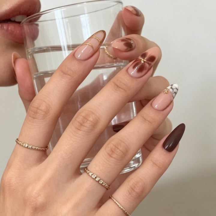 Artificial nails with elegant marble pattern and delicate accents Stornfield