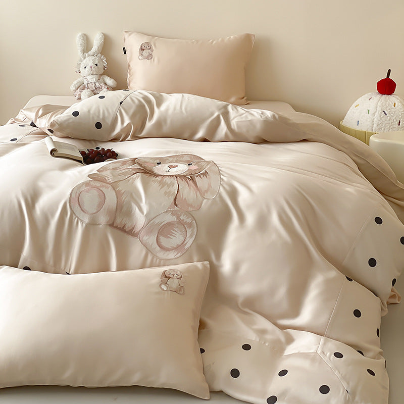 Reversible satin bedding set for children with a large watercolor teddy, polka dot border, and silky-matte finish