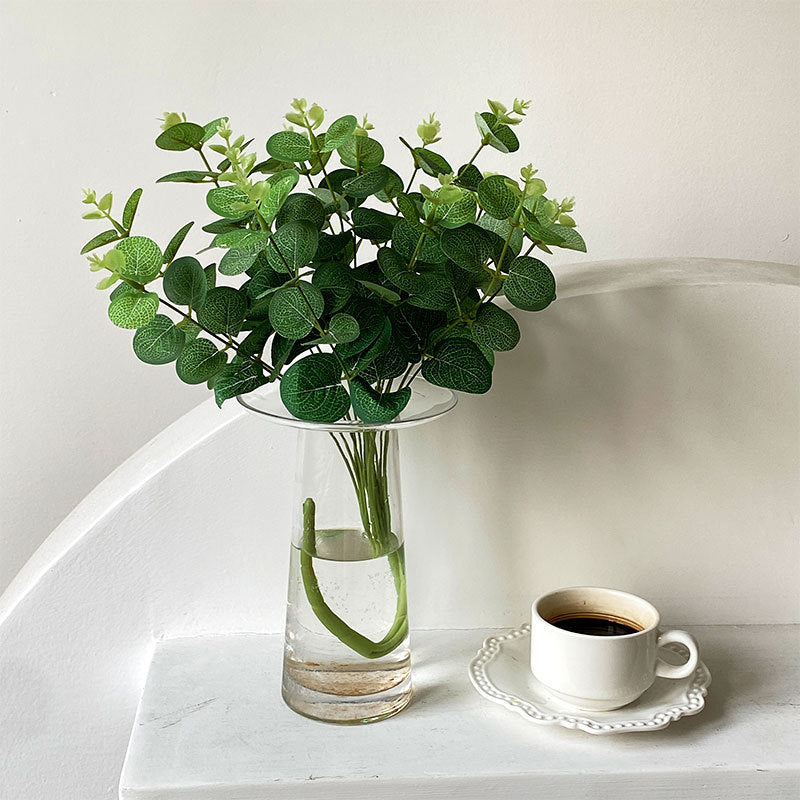 Artificial flowering branch with lifelike leaves and delicate flowers
