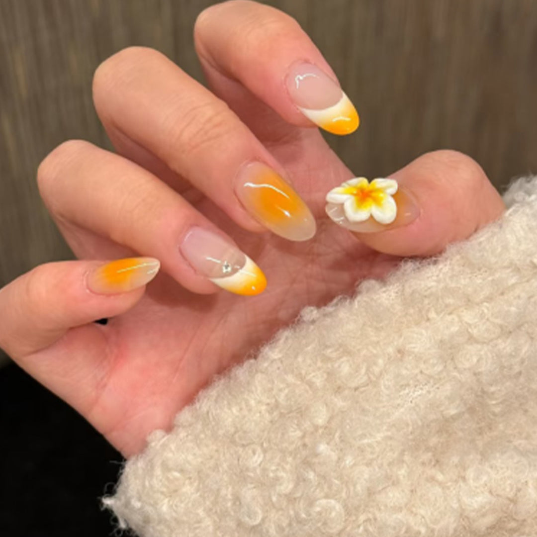 Artful nail extensions with delicate ombre effect and floral accents Stornfield