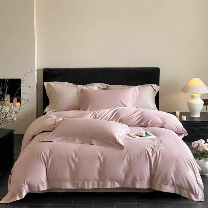 Luxurious cotton satin bedding set with monogram embroidery and fine piping