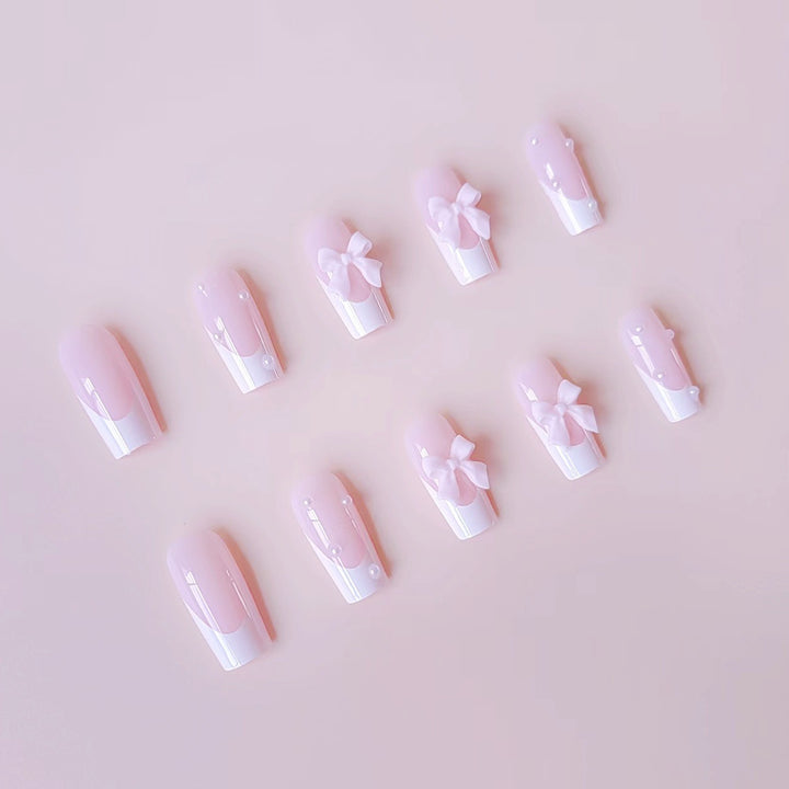 Artificial nail set with elegant bow and pearl decorations Stornfield