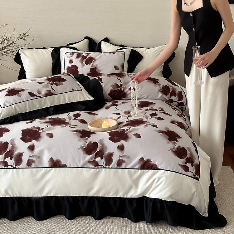 Luxury bed cover set made of cotton satin with abstract watercolor flower print and contrasting ruffle