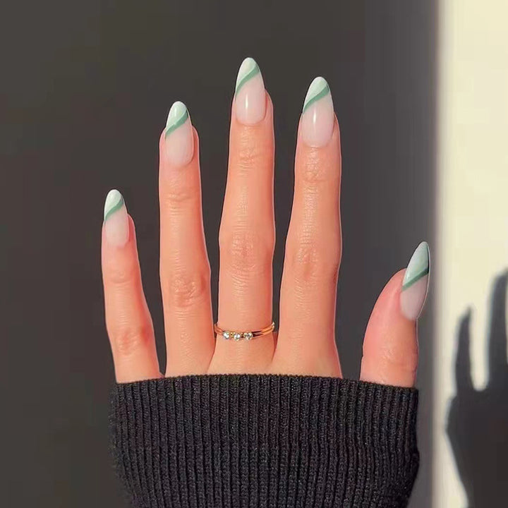 Artful nail extensions with an elegant leaf pattern Stornfield