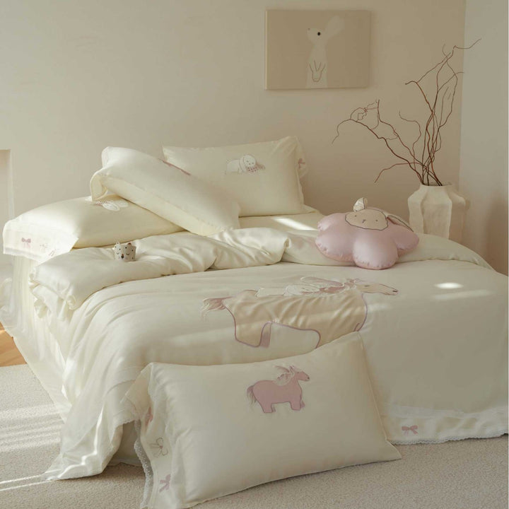 Child bedding set made of cotton satin with appliqués, ruffles, and cuddle pillow