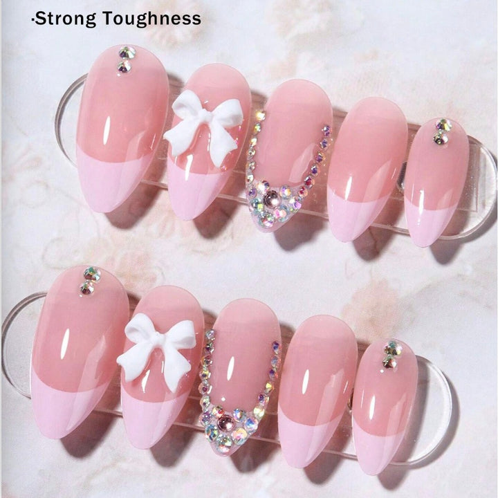 Acrylic nail set with elegant 3D bows and sparkling rhinestone embellishments Stornfield