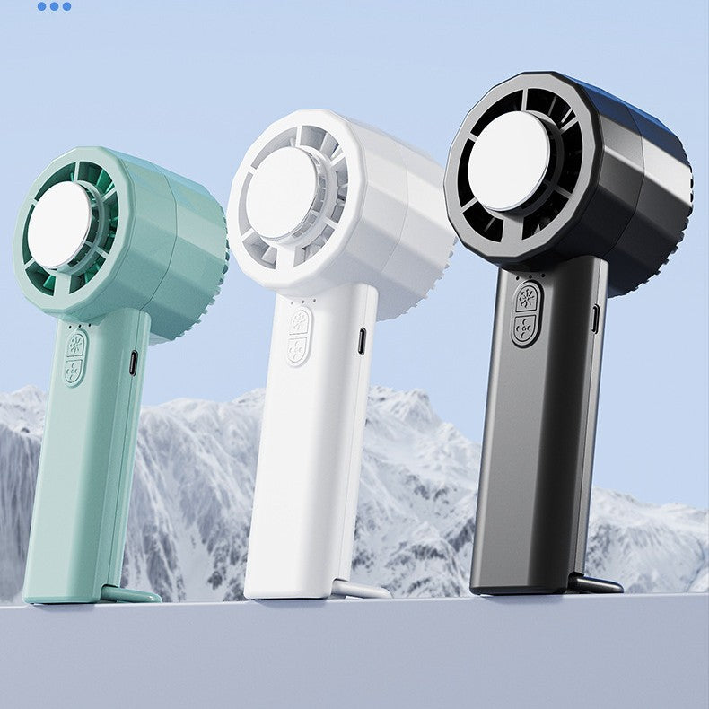 Unisex portable mini hand fan with USB-C charging port and integrated mist spray function Stornfield