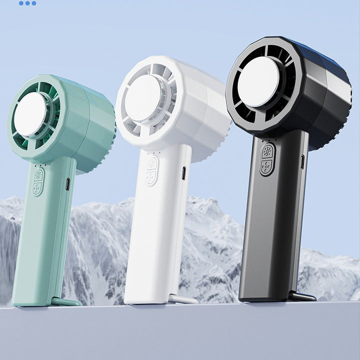 Unisex portable mini hand fan with USB-C charging port and integrated mist spray function Stornfield