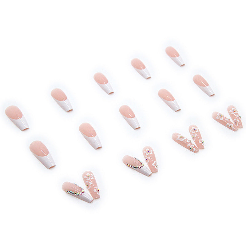 Artificial nail set with romantic floral decorations and glitter accents Stornfield
