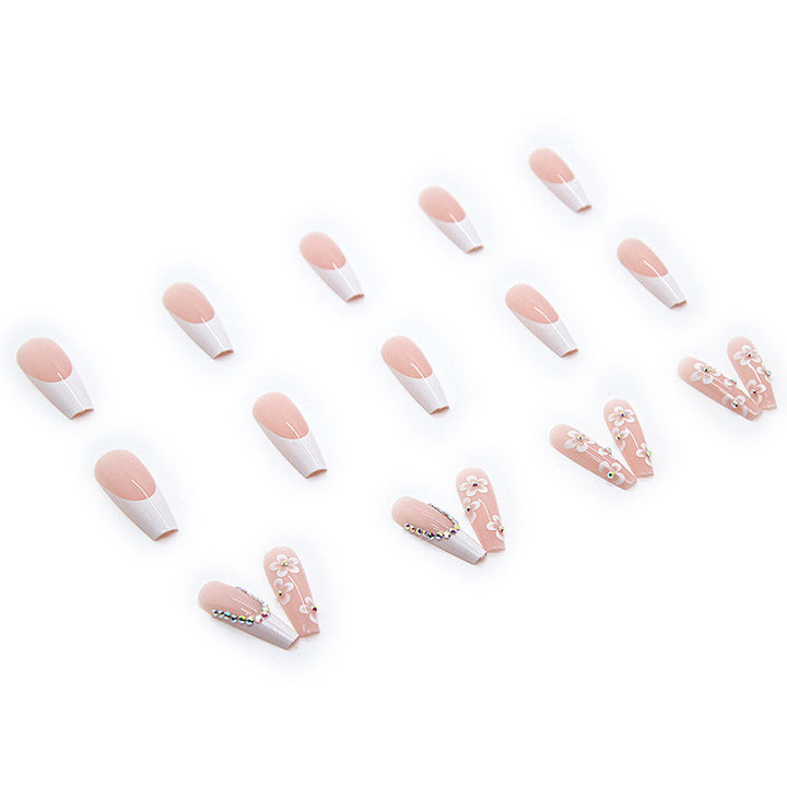 Artificial nail set with romantic floral decorations and glitter accents Stornfield