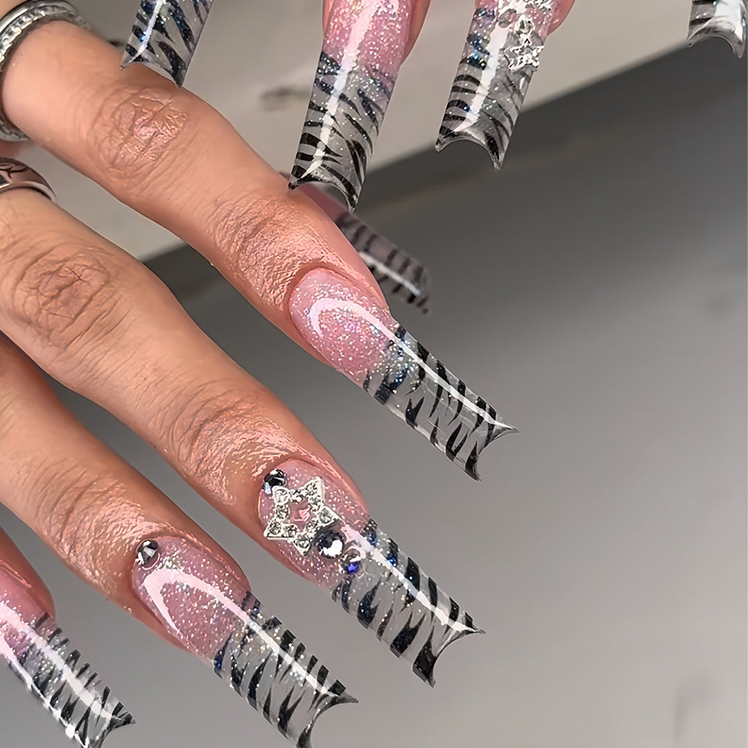 Artistic Stiletto Nail Enhancements with Glamorous Glitter Stornfield