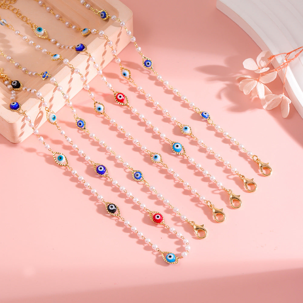 Elegant Pearl and Eye Charm Necklace Stornfield