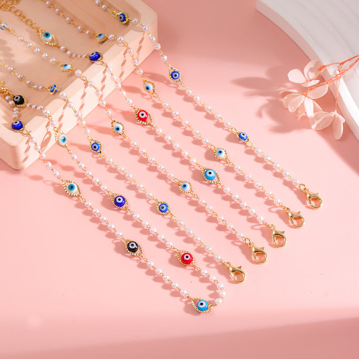 Elegant Pearl and Eye Charm Necklace Stornfield