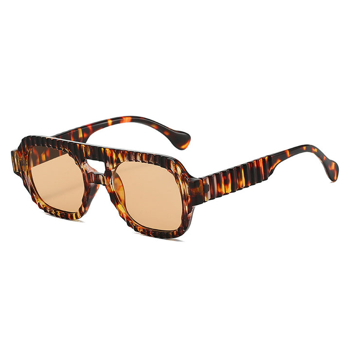 Ladies fashionable sunglasses in futuristic design with textured frame Stornfield
