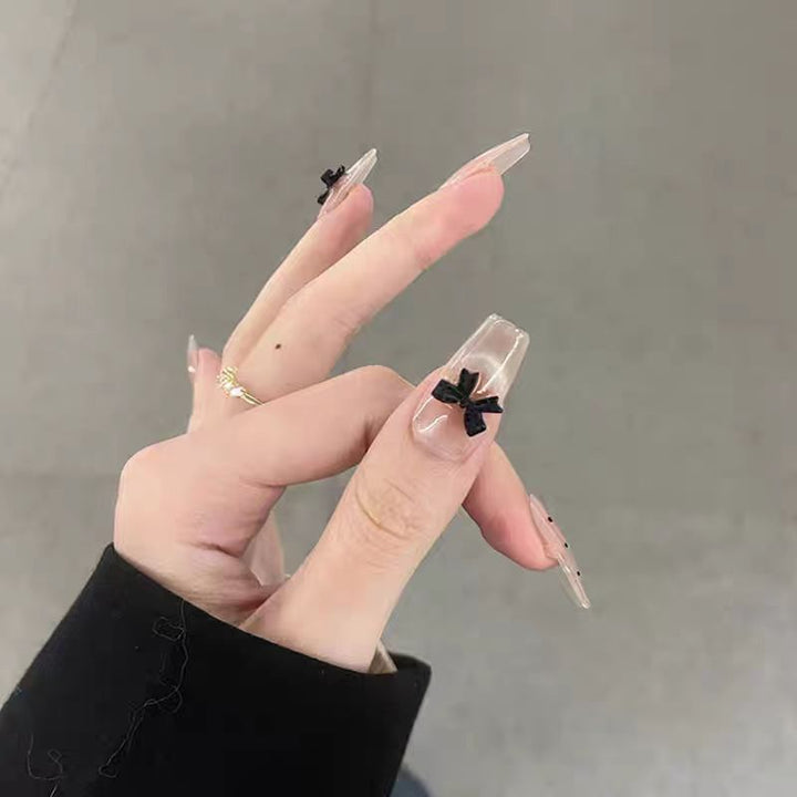 Artificial nails with playful bow design Stornfield
