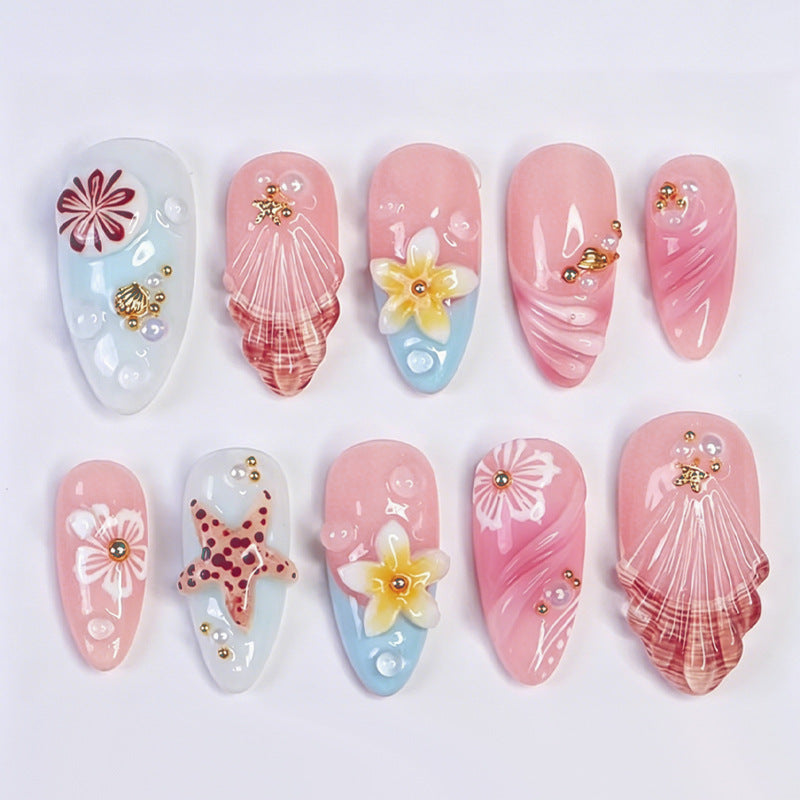 Artificial nail set with maritime designs and glittering accents Stornfield
