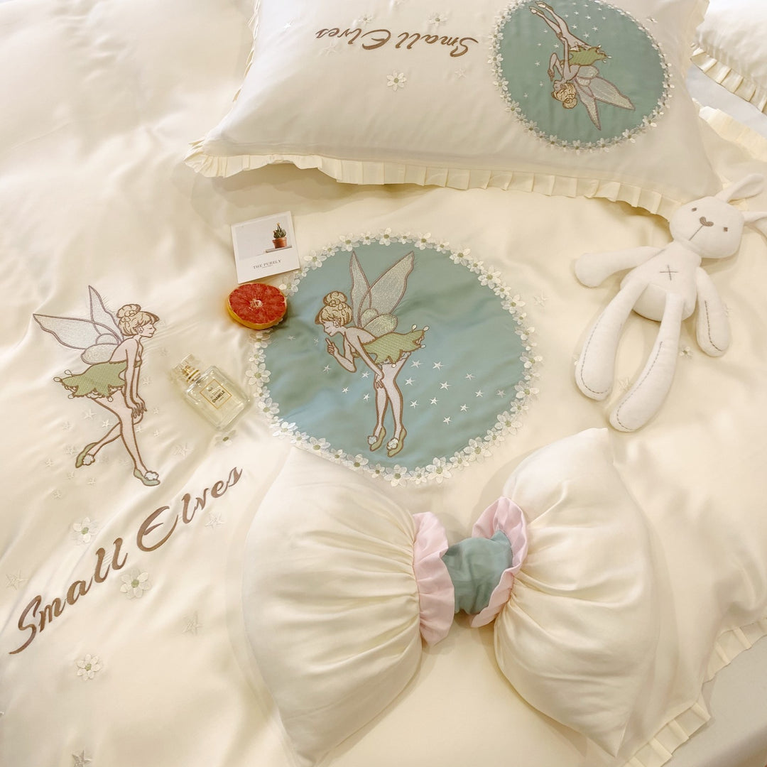 Satin bedding set with fairy embroidery, ruffled hem and decorative pillowcases