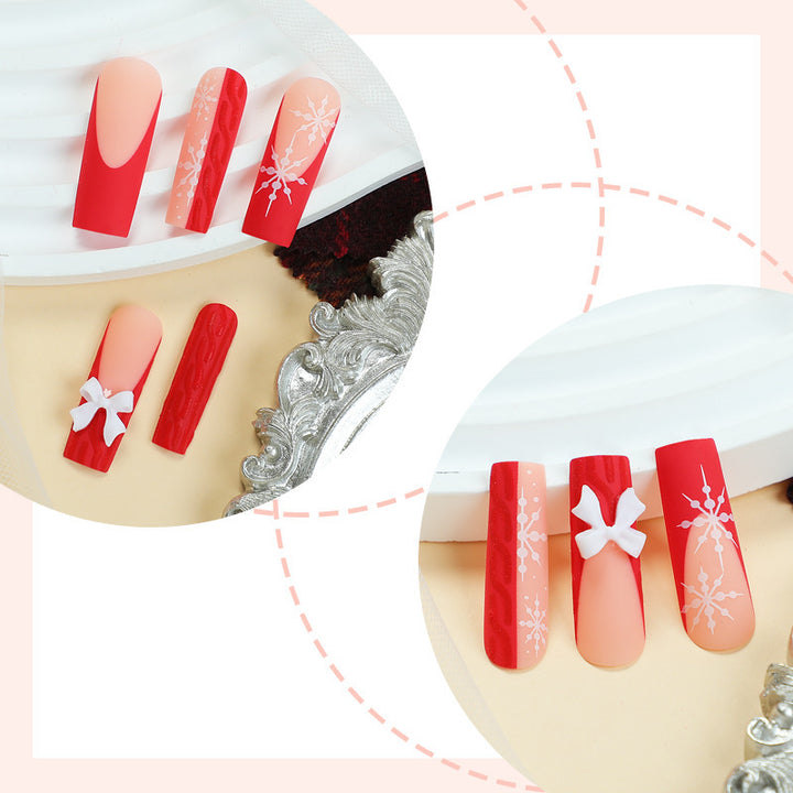 Artificial nail set with festive snowflake and bow motifs Stornfield