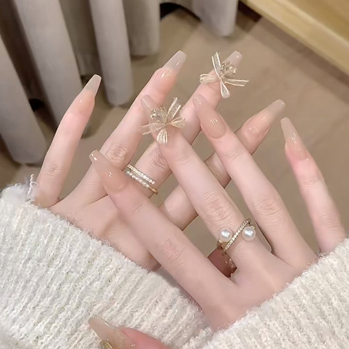 Artificial nail set with elegant 3D patterns and delicate accents Stornfield