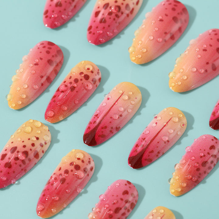 Creative artificial nails with appealing ombre and glitter effects Stornfield