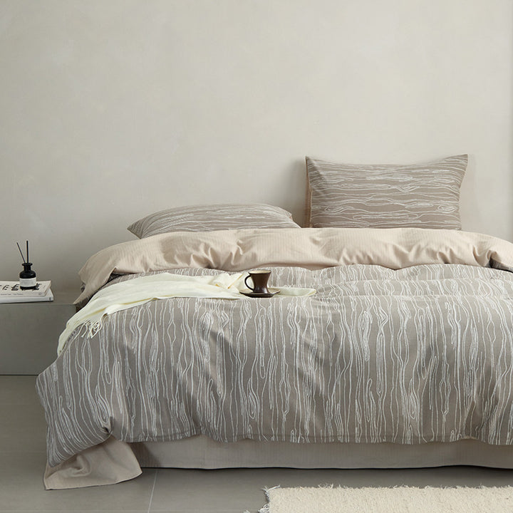 Modern bedding set made of cotton percale with organic stain pattern