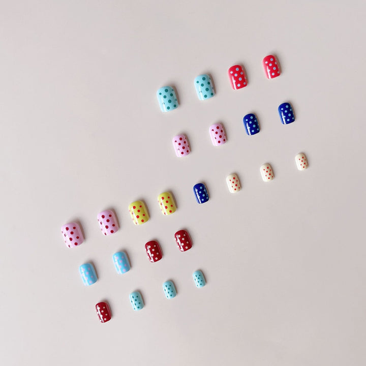 Artificial nail set with colorful dots and cheerful designs Stornfield