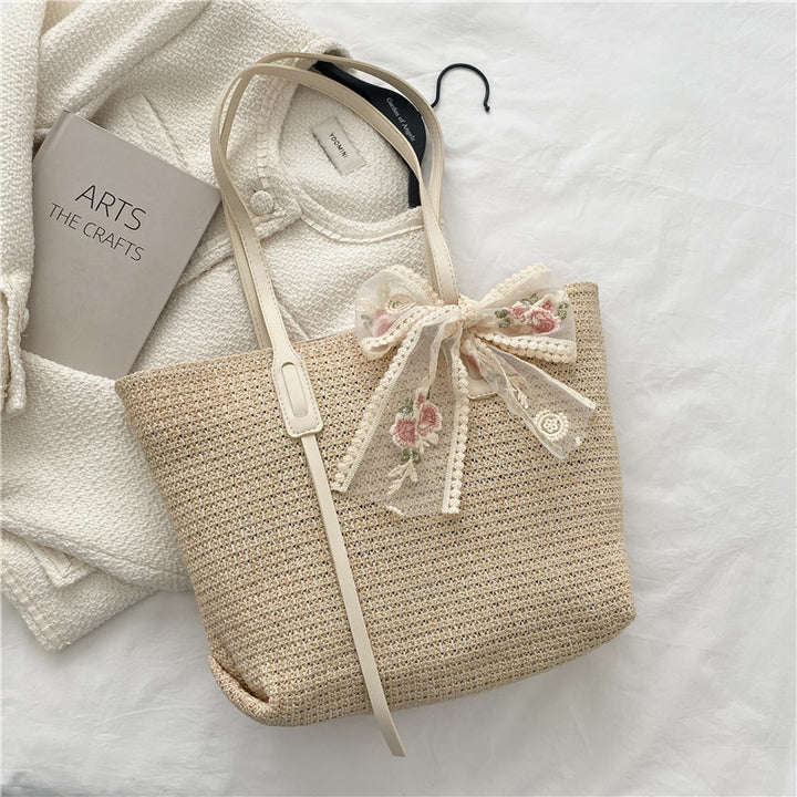 Elegant Woven Straw Tote Bag with Decorative Bow