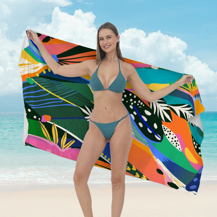 Beach towel with vibrant tropical plant motif Stornfield