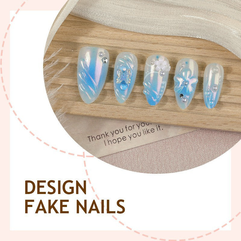Artificial nail creation with floral designs and glitter accents Stornfield