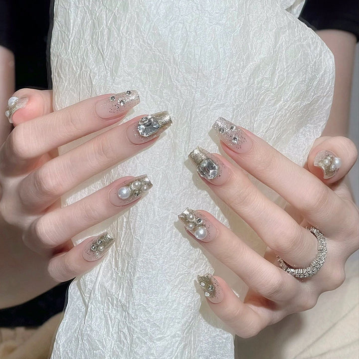 Artificial nail set with elegant pearl and glitter design Stornfield