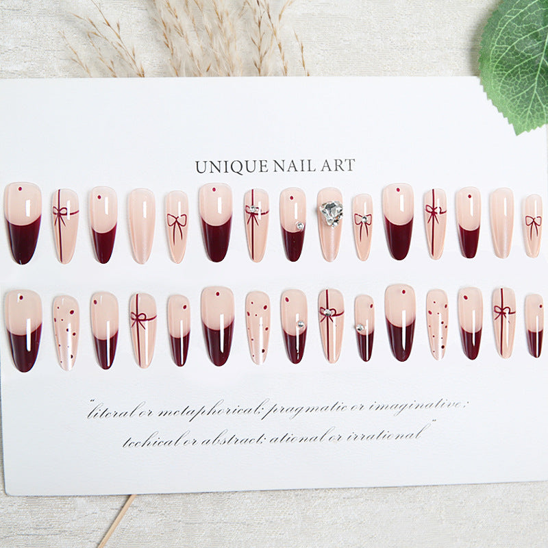 Artificial nail set with elegant bow and glitter details Stornfield