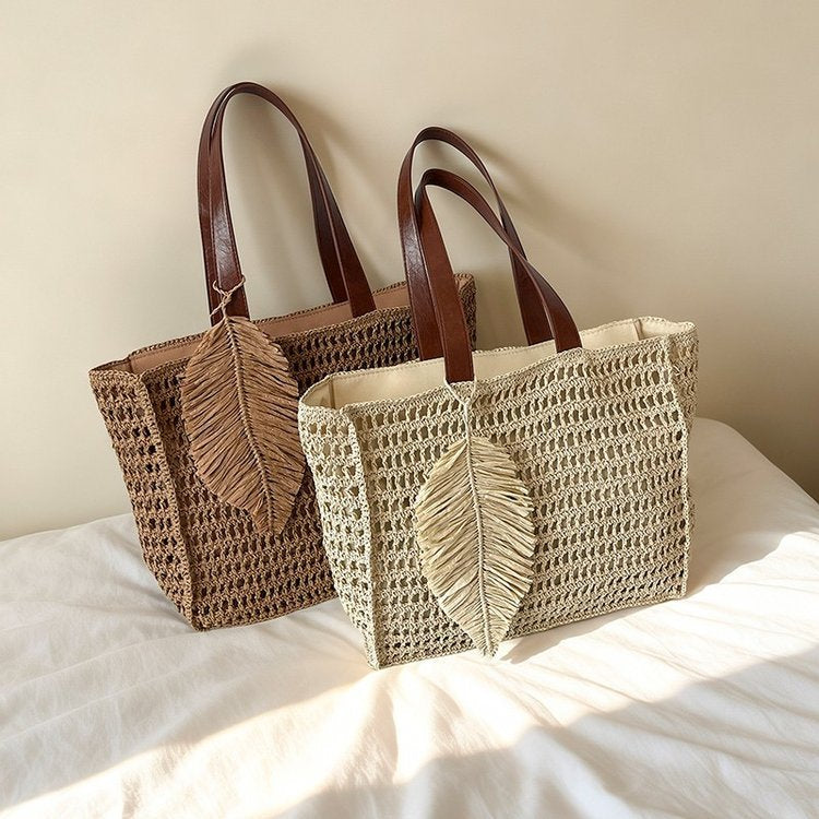 Handbag made of hand-woven natural material with decorative leaf shape design Stornfield