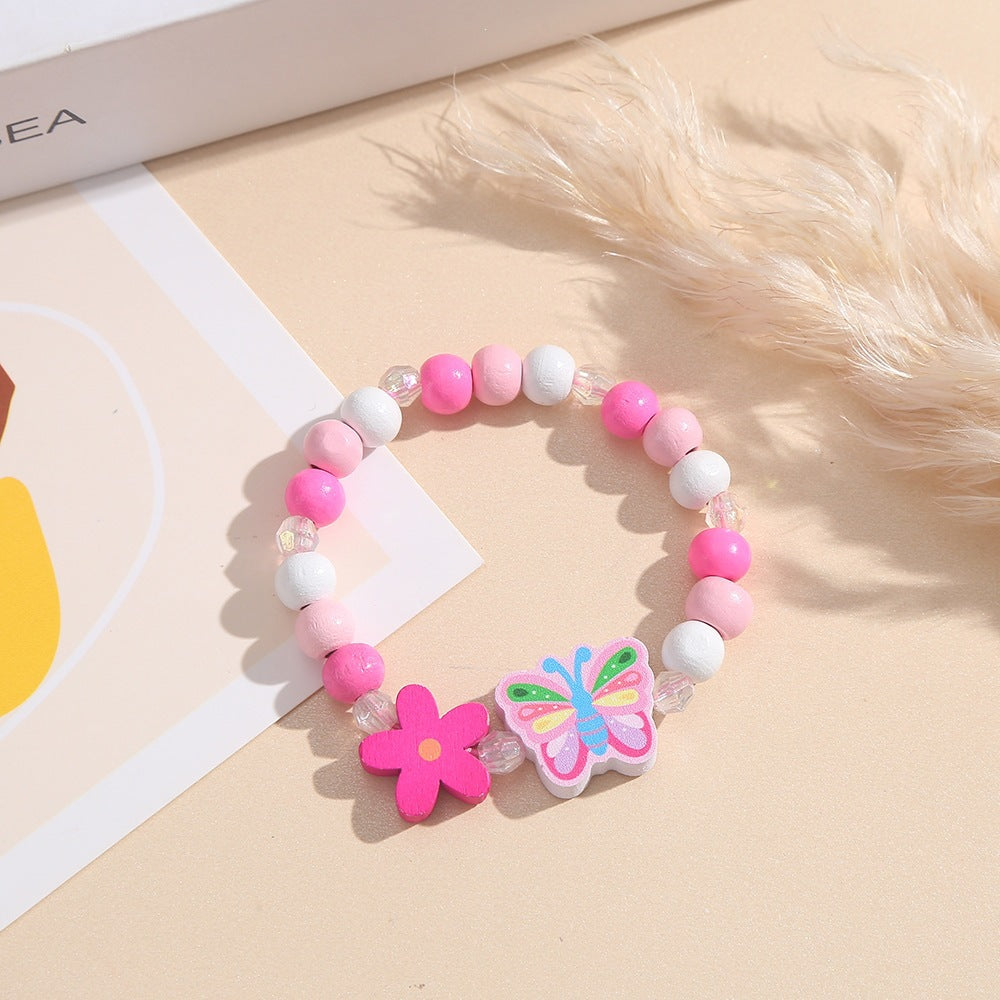 Playful bracelet with heart and butterfly charms Stornfield