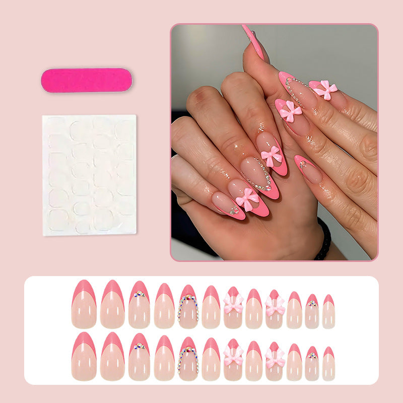 Artificial nail set with playful floral decorations and elegant glitter accents Stornfield