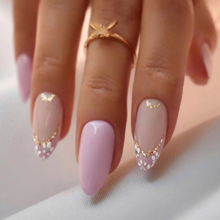 Elegant artificial nails with floral design and golden accents Stornfield