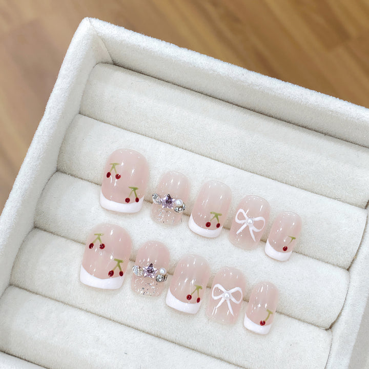 Decorative Press-On Nail Art with Floral and Bow Accents