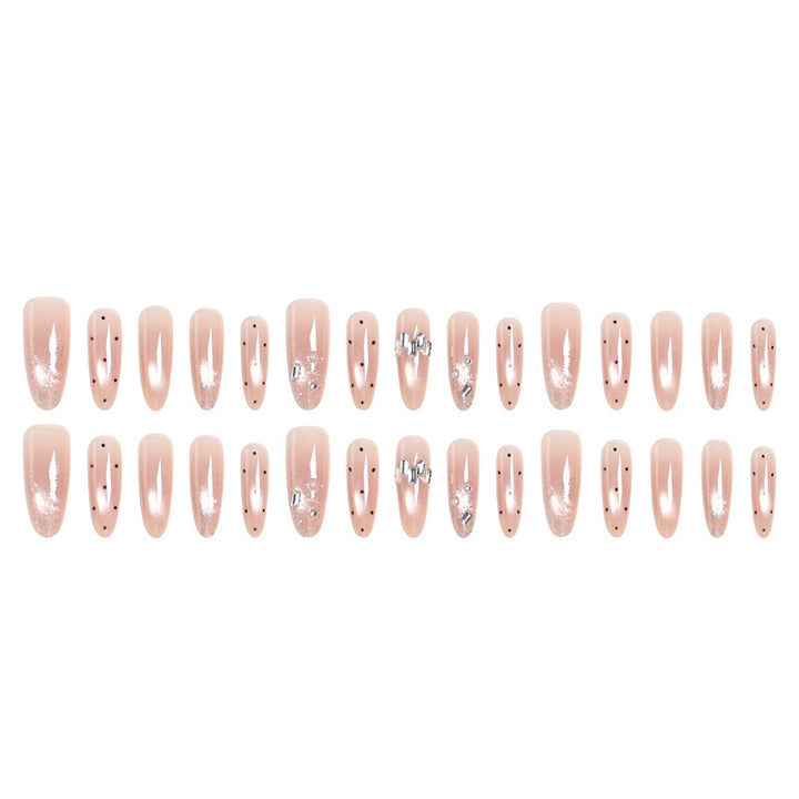 Artificial nail set with sparkling glitter and elegant jewelry details Stornfield