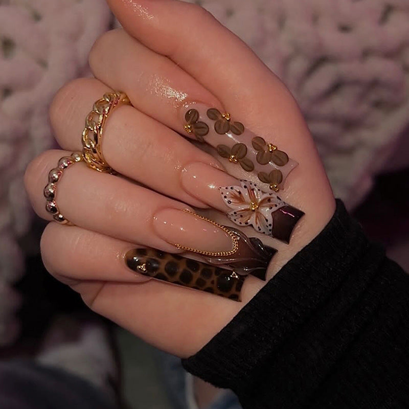 Nail design with floral accents and elegant details Stornfield